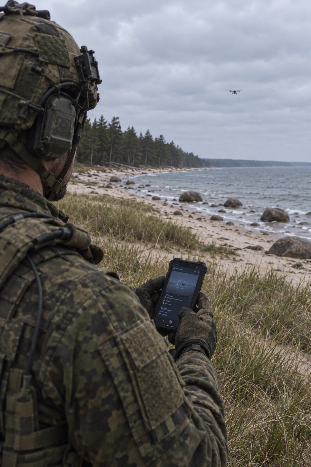 Soldier using a tactical device on a Baltic coastal landscape with pine forest and an observation drone